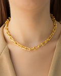 Gold bead link chain necklace worn on model, featuring a modern gold chain with polished bead details by Jadejuri