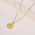 18k gold plated necklace with delicate chain and circular sunburst medallion pendant