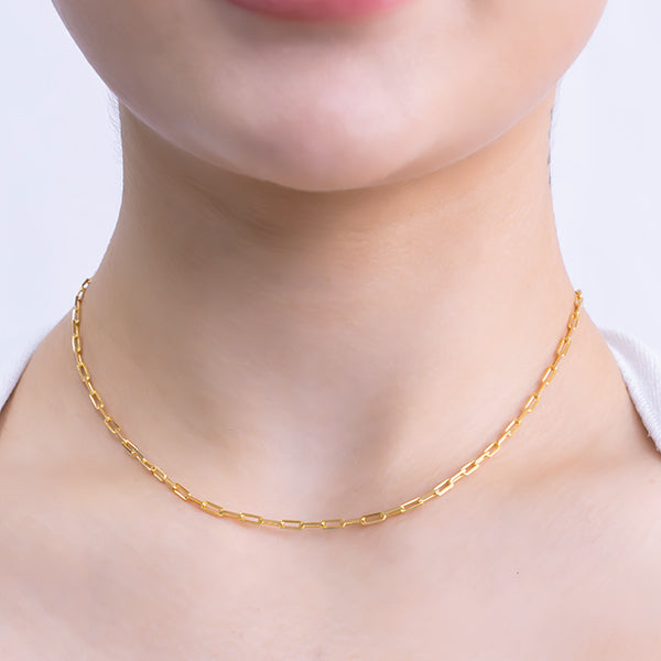 18k gold plated chain necklace with elongated rectangular links featuring a delicate hammered texture model close up
