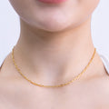 18k gold plated chain necklace with elongated rectangular links featuring a delicate hammered texture model close up

