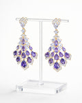 Amethyst cascade gold drop earrings with purple zirconia on display stand elegant