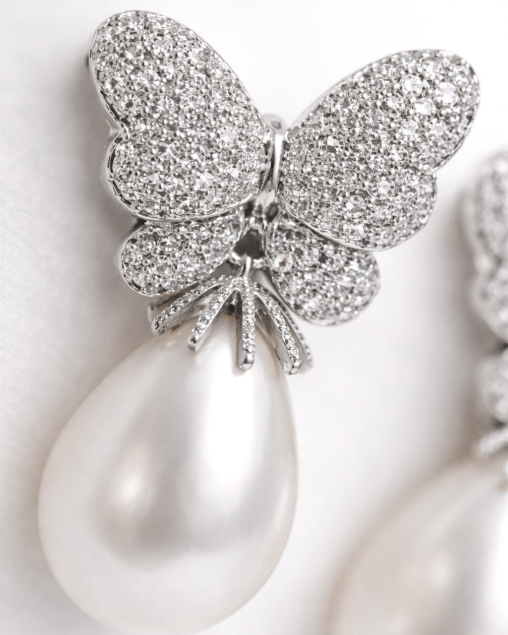 Butterfly pearl drop earrings silver plated cubic zirconia macro pearl detail view