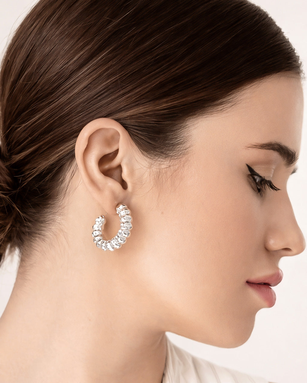 18K gold-plated melted flow statement ring worn on model hand, modern sculptural design