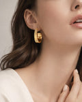 18k gold plated bold hoop earrings worn by model, modern minimalist women style