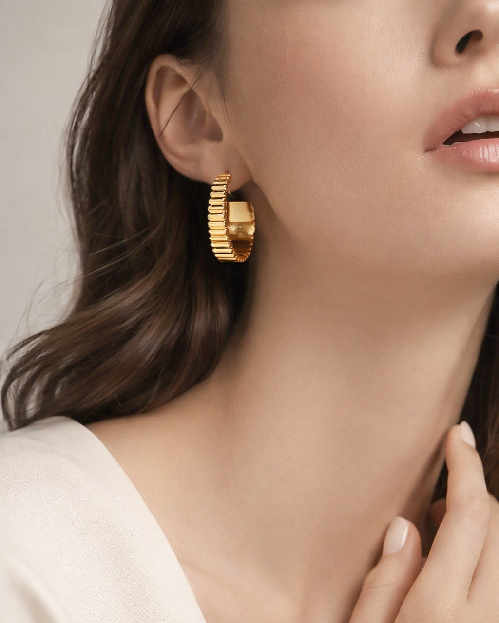 18k gold plated bold hoop earrings worn by model, modern minimalist women style