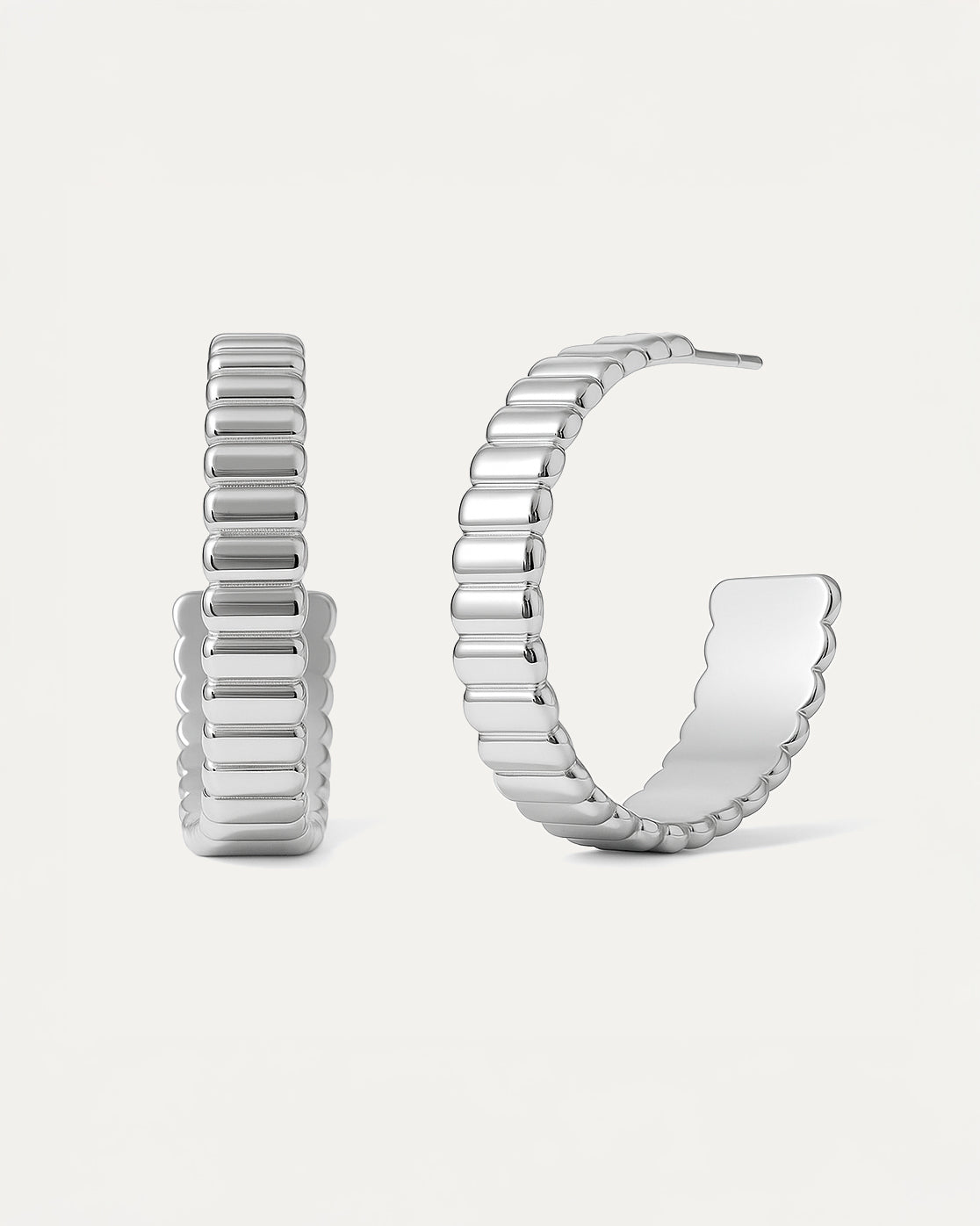 Bold Groove Hoops in silver with sculptural ridged design and half-circle shape, statement earrings from Jadejuri.