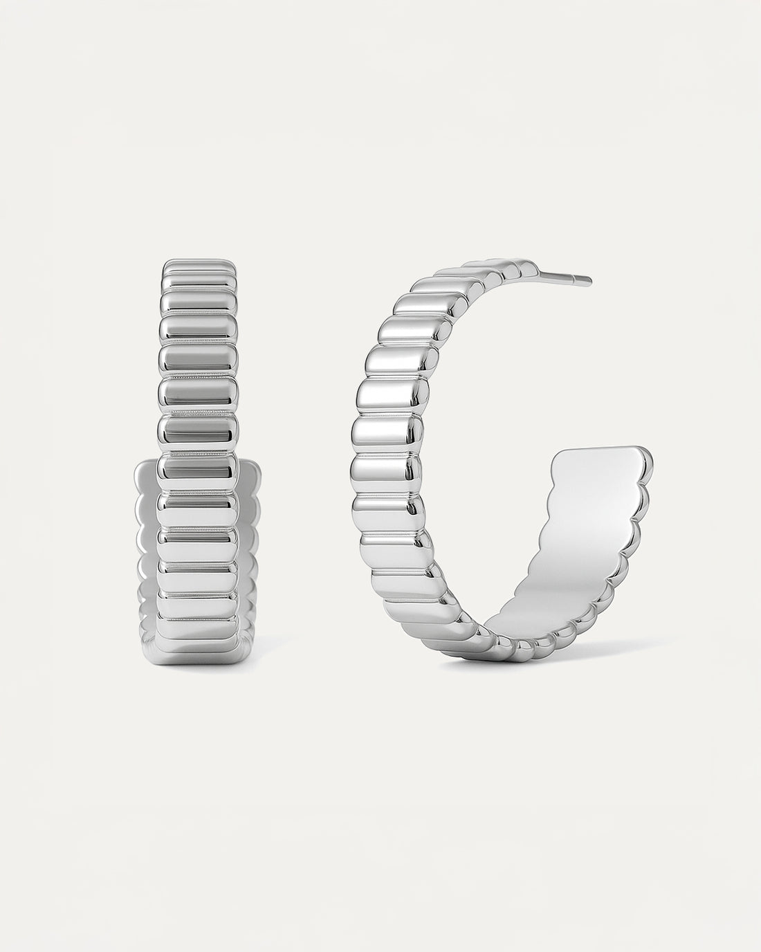 Bold Groove Hoops in silver with sculptural ridged design and half-circle shape, statement earrings from Jadejuri.