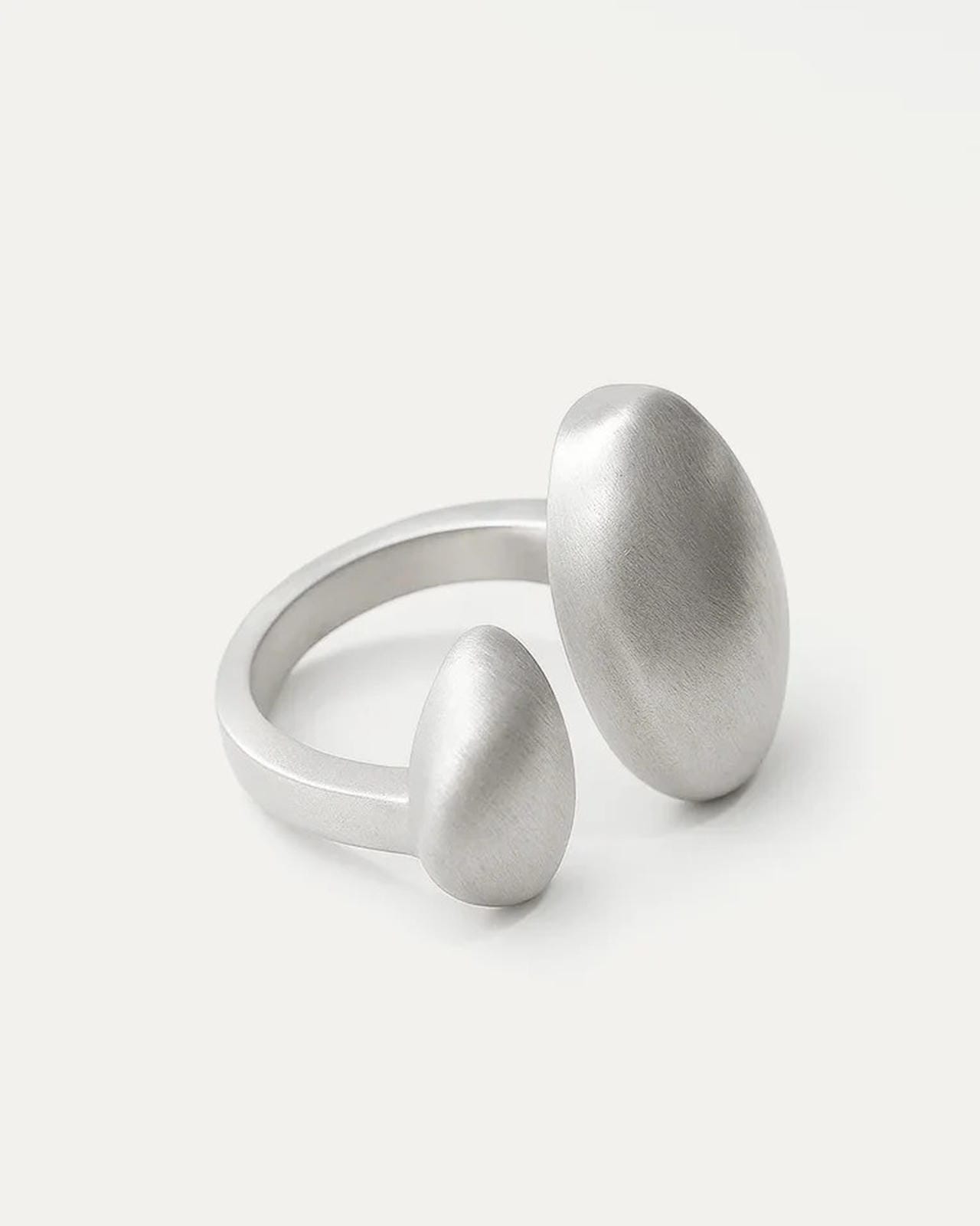 Pair of silver rings with textured surfaces on a white background