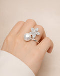 Silver pearl blossom open ring on hand, silver-plated brass