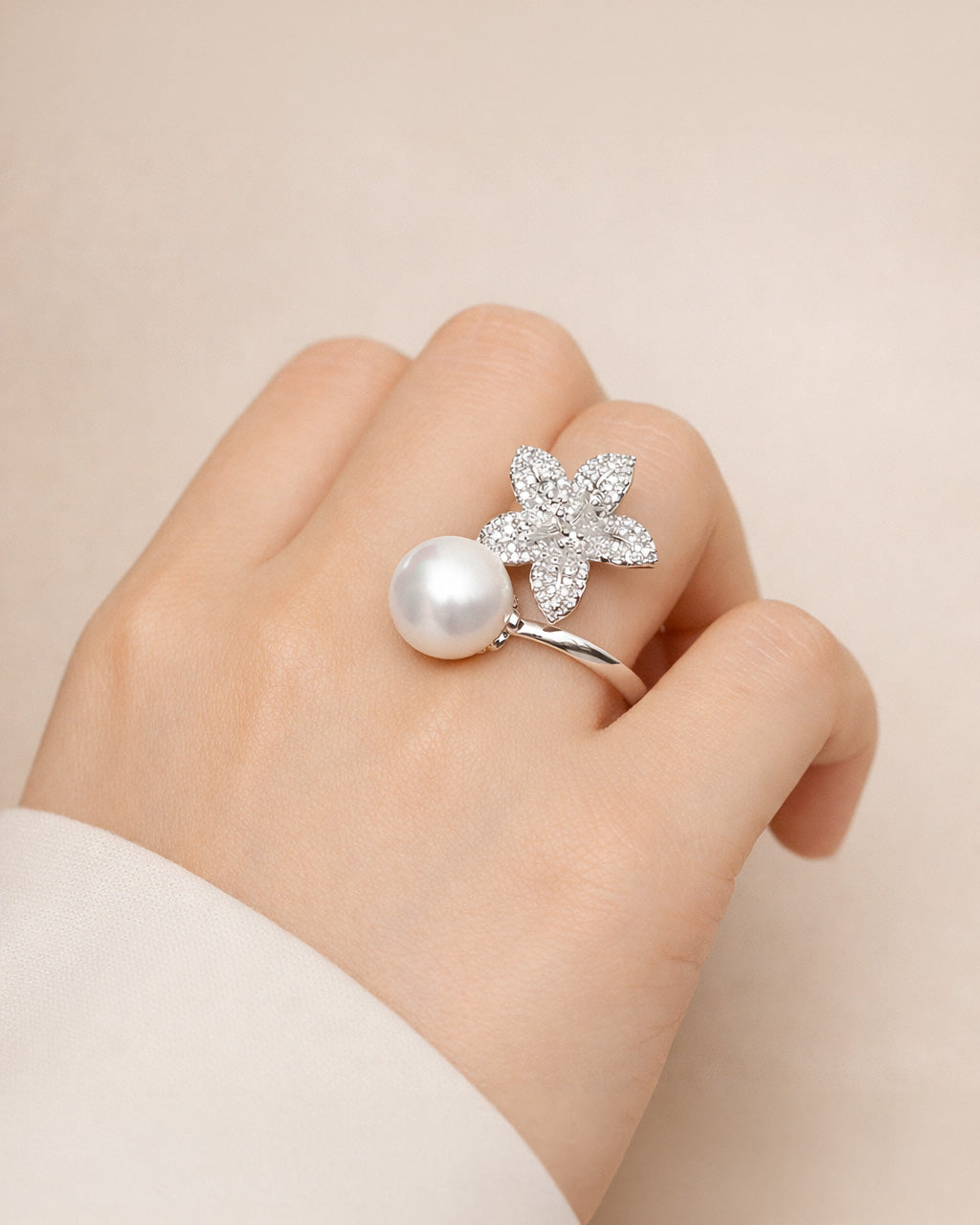 Silver pearl blossom open ring on hand, silver-plated brass