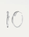 Pair of silver hoop earrings with small diamonds on a light gray background