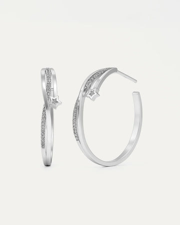 Pair of silver hoop earrings with small diamonds on a light gray background