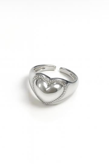 Silver heart-shaped ring on a white background