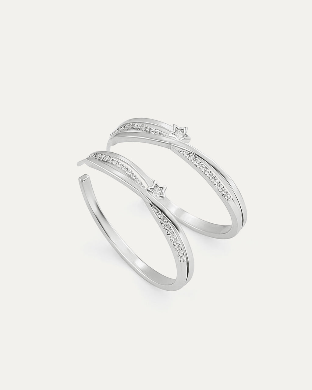 Pair of silver hoop earrings with small diamonds on a light gray background