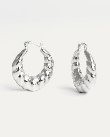 Chunky Spiral Hoops in polished silver with twisted sculptural design – Jadejuri