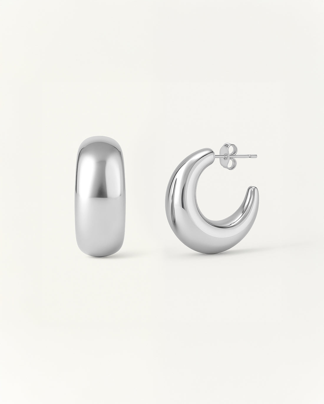 Crescent Curve Hoops in polished silver with rounded sculptural design