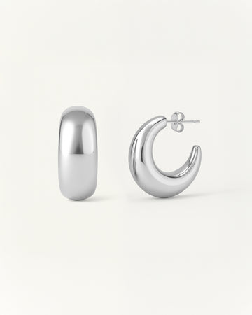 Crescent Curve Hoops in polished silver with rounded sculptural design