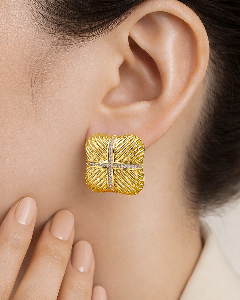 Crystal cross square stud earrings in 18K gold-plated finish worn on model close-up