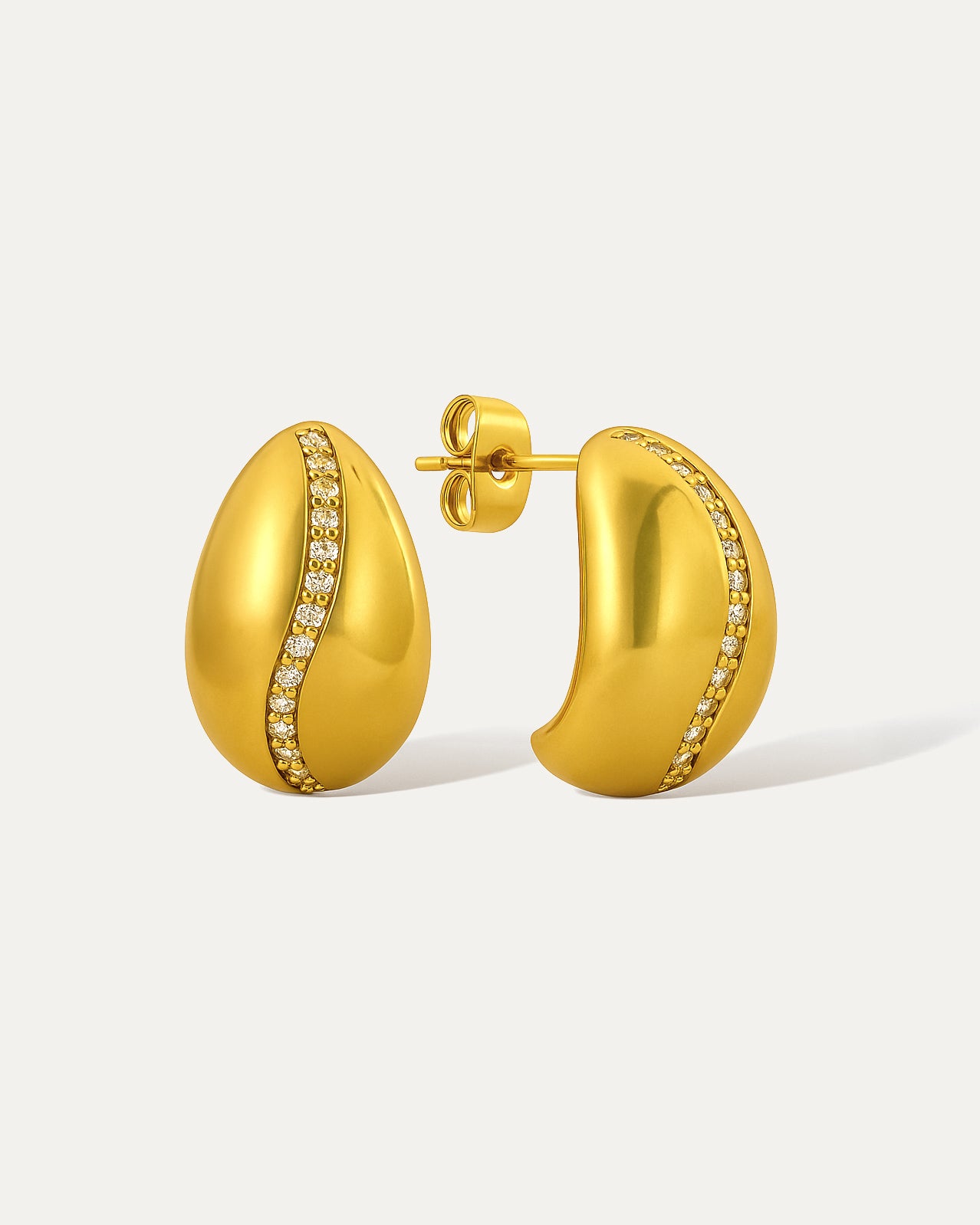 18k gold plated curved stud earrings with a diagonal line of crystals across smooth polished surface