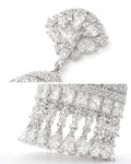 Cubic zirconia crystal bell tassel earrings close-up, silver statement details