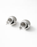 Jadejuri silver-plated dome hoop earrings, modern crescent studs on white bg