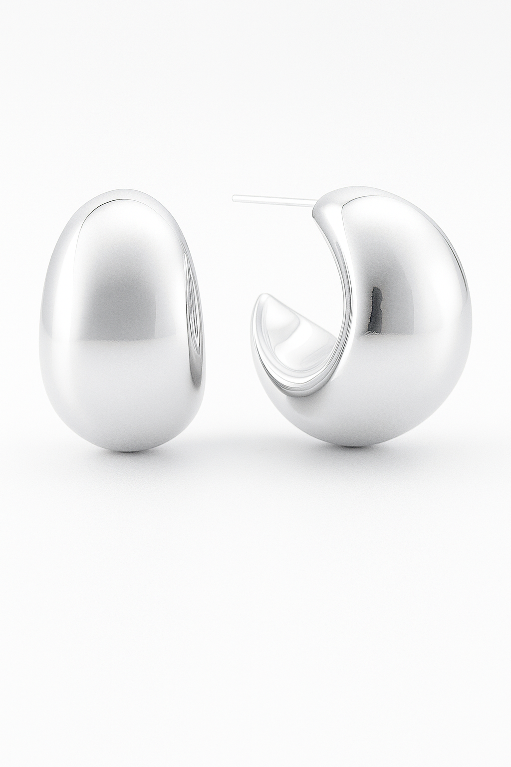 Pair of silver hoop earrings on a white background
