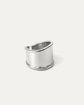 silver-plated wide band statement ring with curved top and open back design on white background