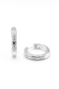 Silver hoop earrings with embedded stones on a white background