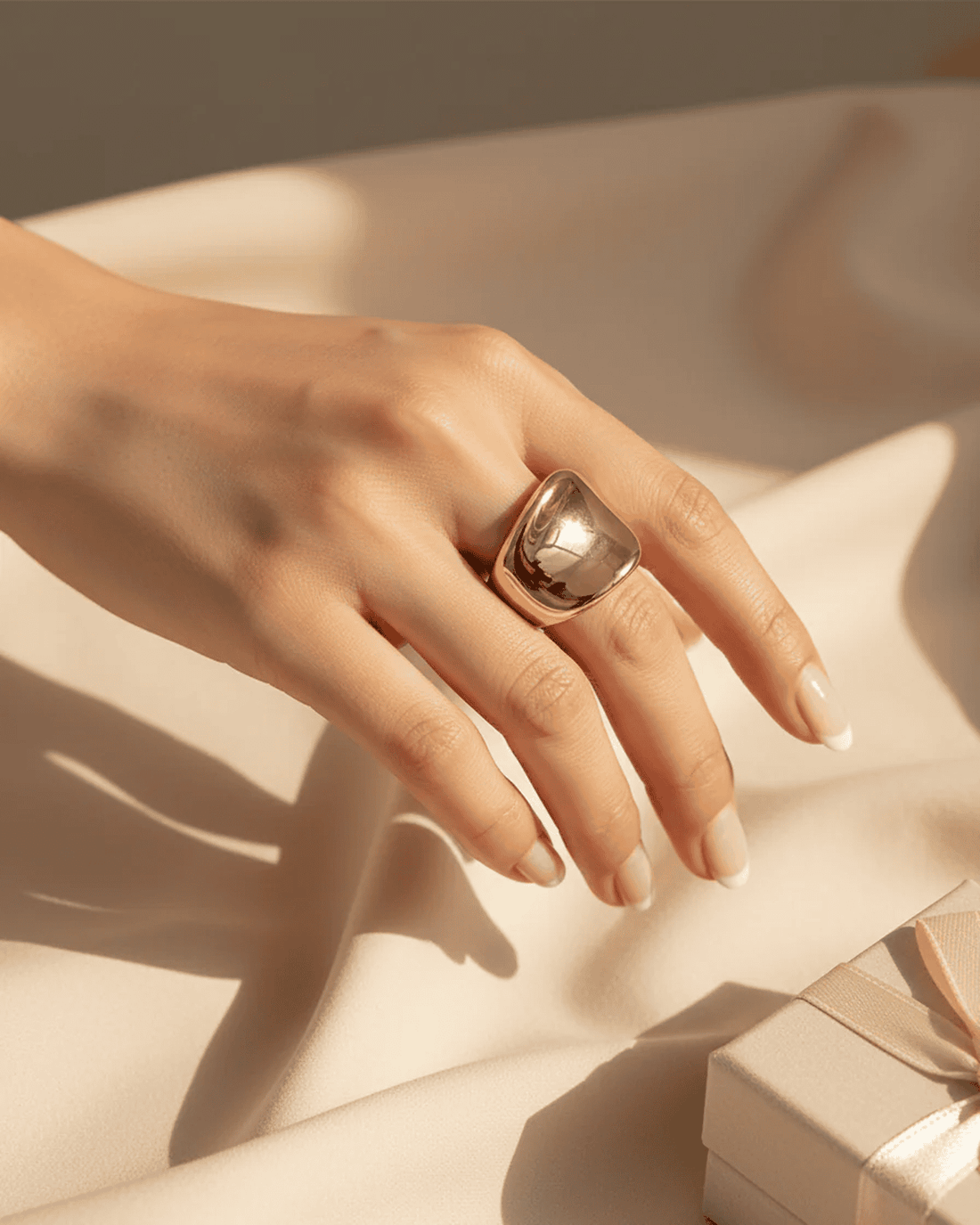 Gold open statement ring with a smooth domed curve and minimal design