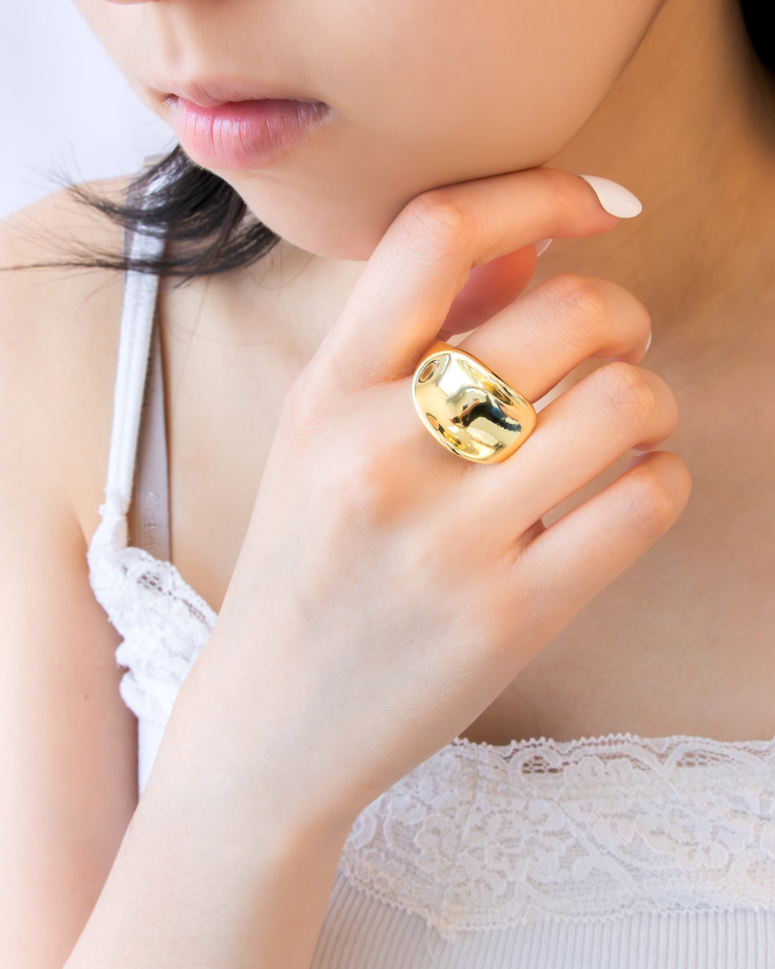 Gold open statement ring with a smooth domed curve and minimal design