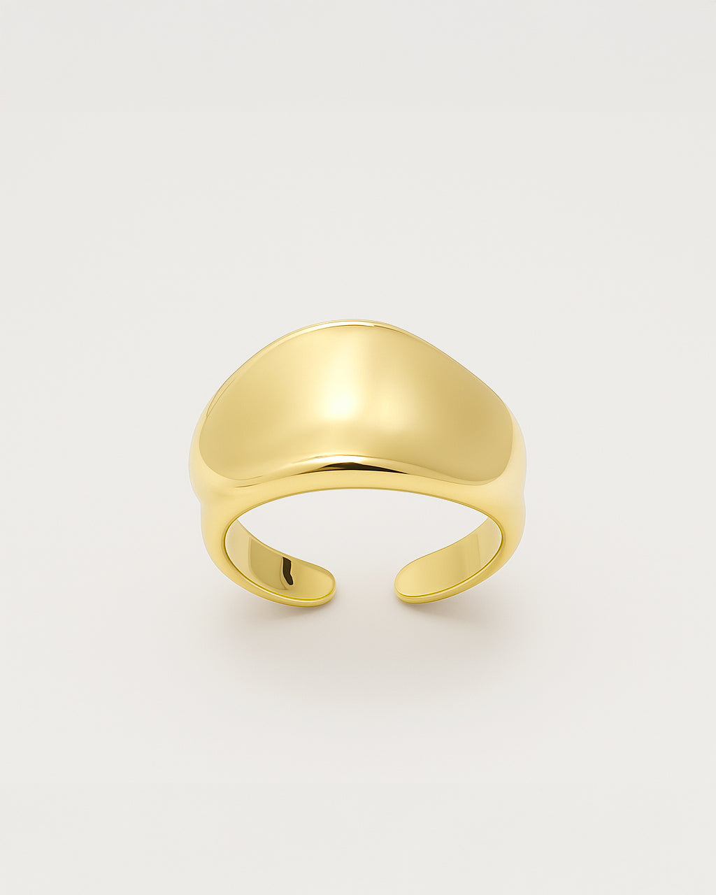 Gold open statement ring with a smooth domed curve and minimal design