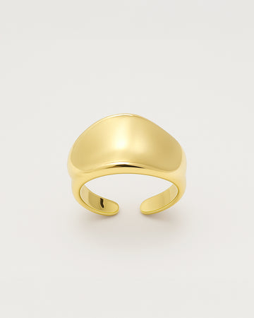 Gold open statement ring with a smooth domed curve and minimal design