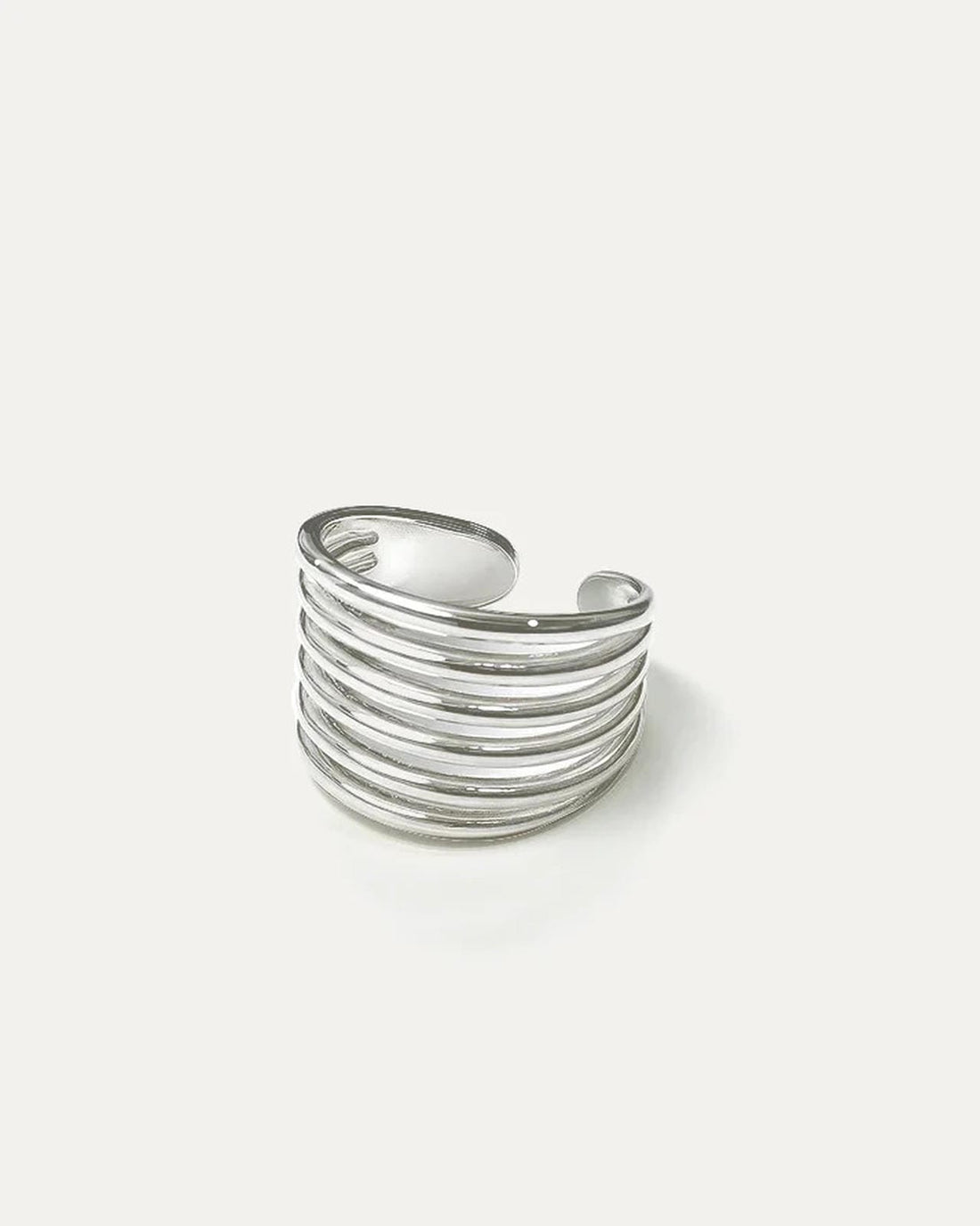 silver statement ring with layered stripe design and open adjustable back on white background