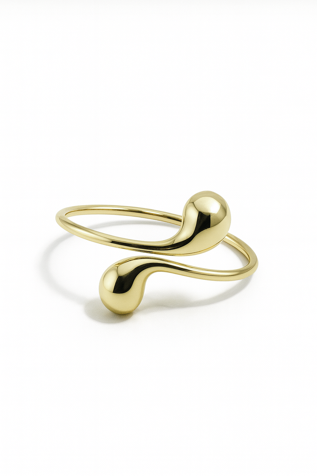 Eclipse Drop Cuff – 18K gold-plated brass bracelet with sculptural droplet-inspired open design.