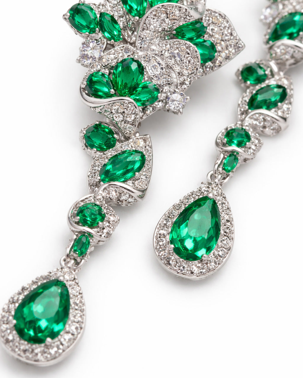 Emerald bloom long drop earrings close-up green cubic zirconia silver plated