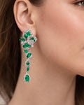 Emerald bloom long drop earrings on ear green cubic zirconia silver plated