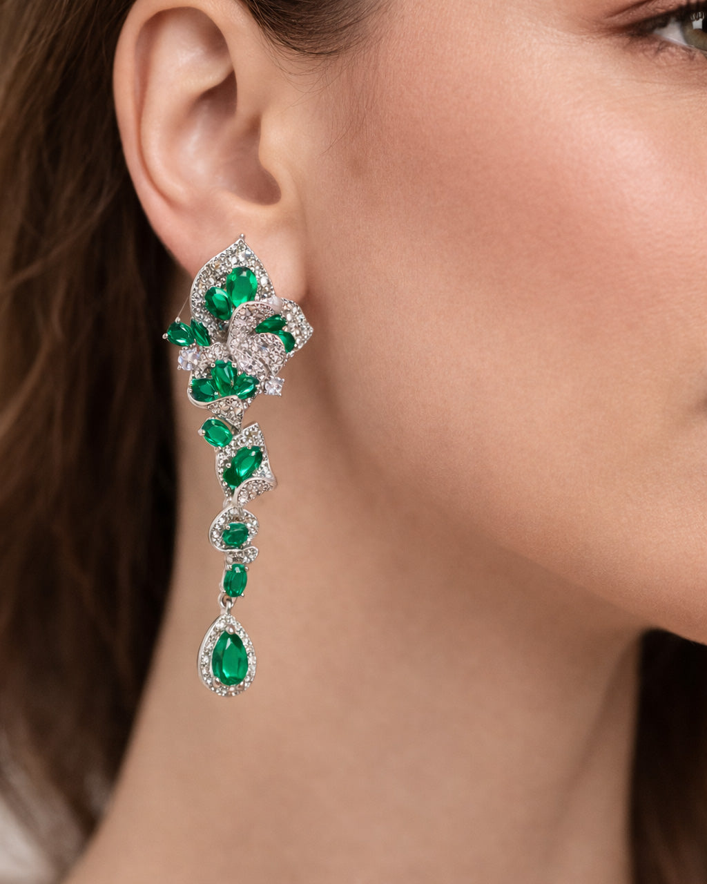 Emerald bloom long drop earrings on ear green cubic zirconia silver plated
