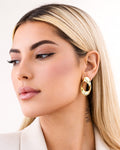 18K gold-plated ripple circle hoop earrings worn by model minimalist jewelry style