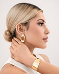 18K gold-plated wave stud earrings worn by model minimalist jewelry look style