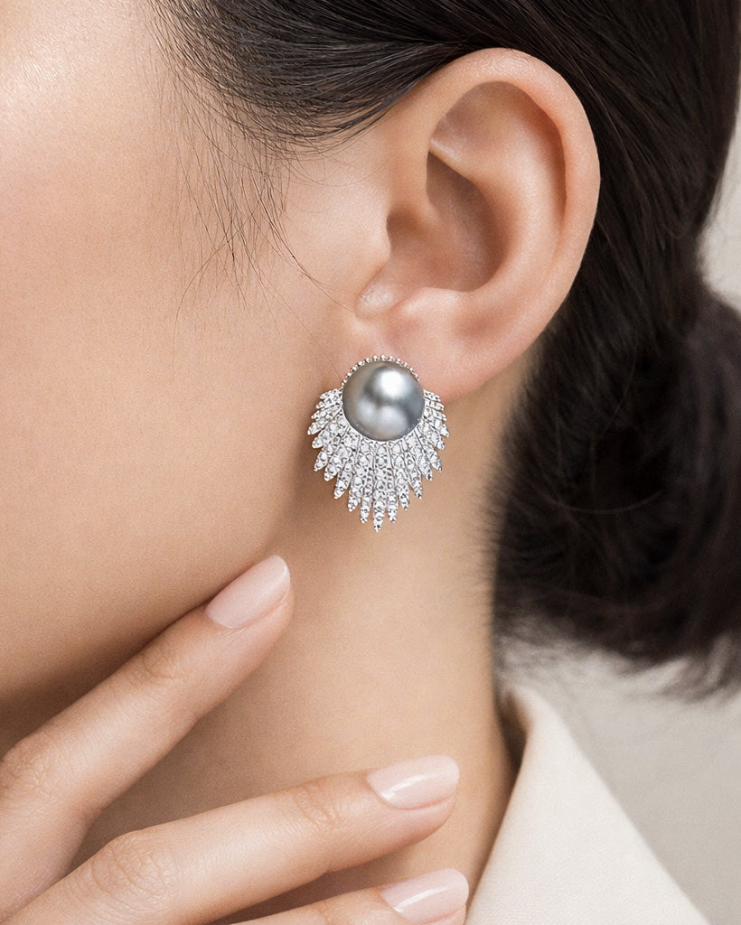 Feather aura pearl drop earrings on ear with cubic zirconia silver plated