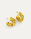 Gold hoop earrings with intricate designs on a white background