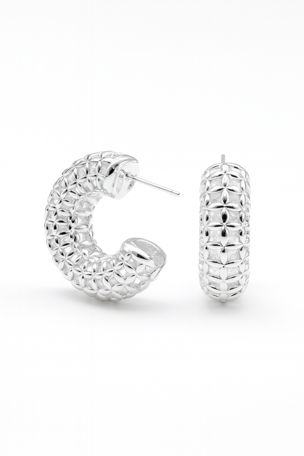 Pair of silver hoop earrings on a white background