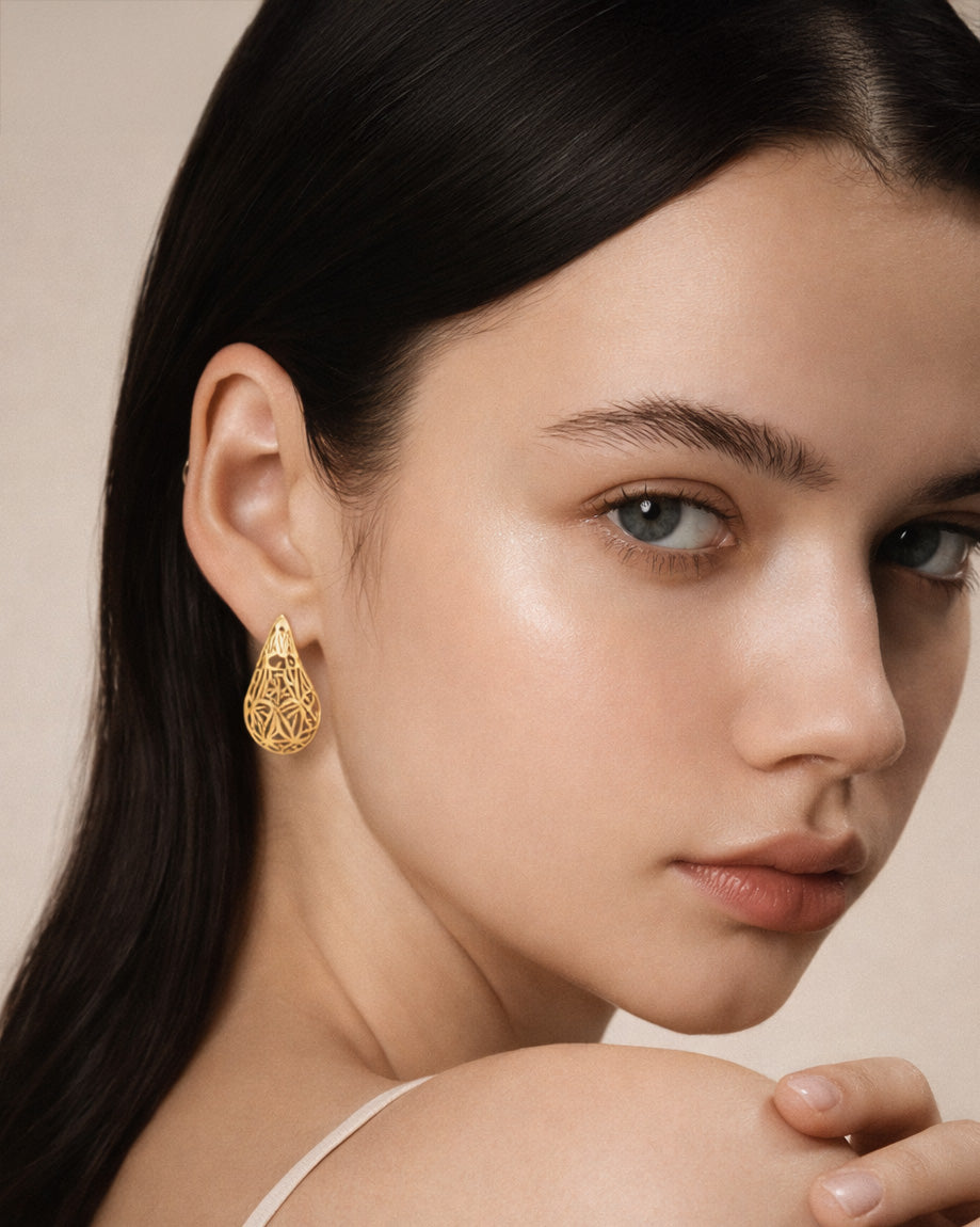 18K gold-plated teardrop stud earrings with geometric openwork design and lightweight sculptural finish