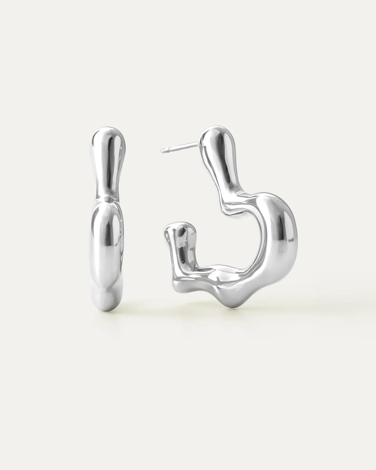 Silver earrings on a white background