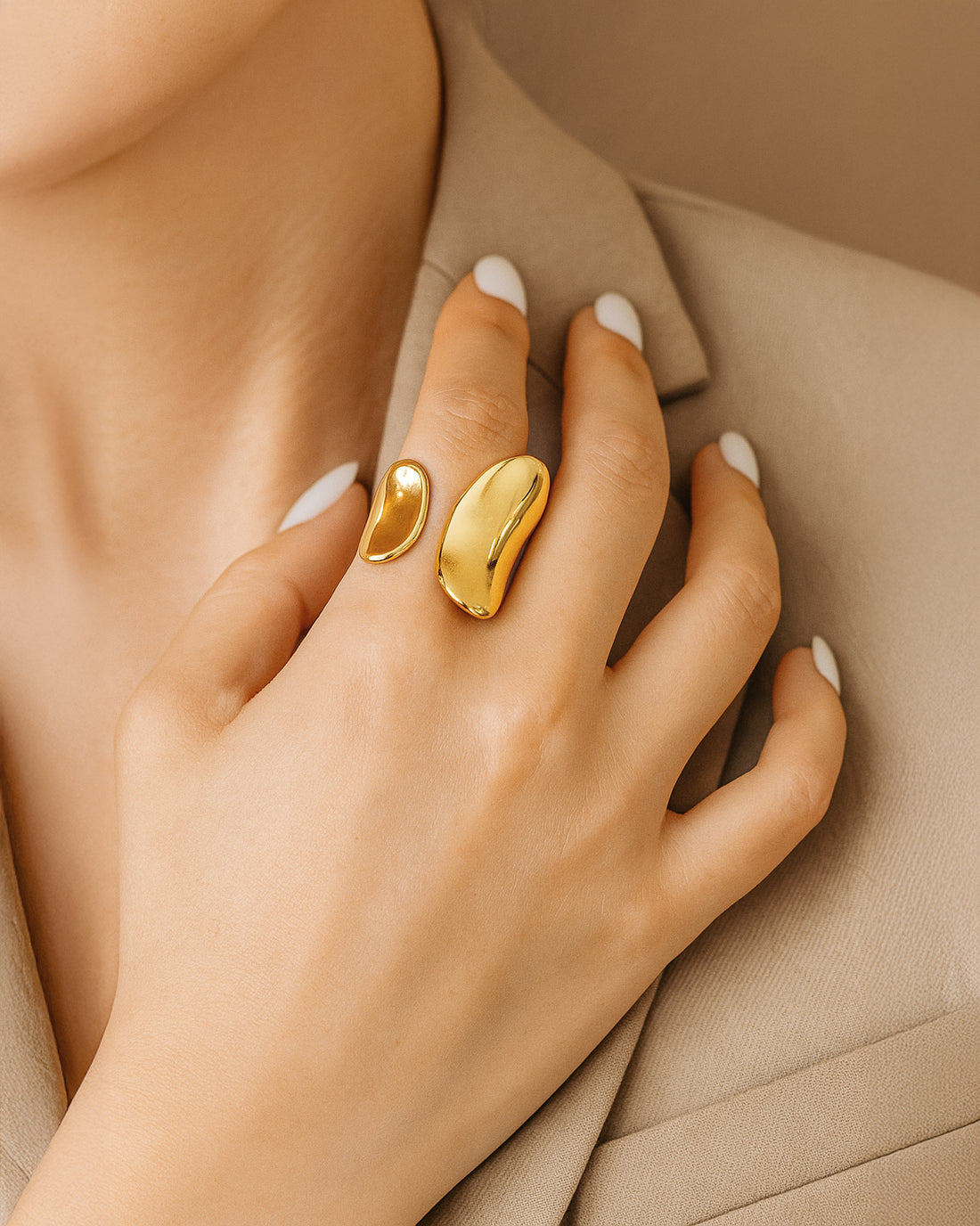 Minimal gold statement ring with open band and sculptural curved ends