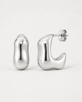 Silver hoop earrings on a light gray background