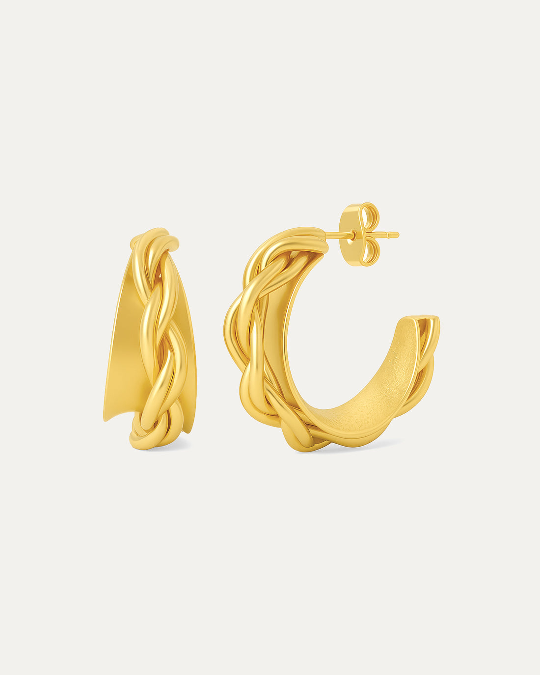 Pair of gold hoop earrings on a light gray background