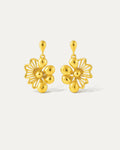 Intricate gold floral dangle earrings with a delicate chain. Perfect for adding a touch of elegance to any outfit.