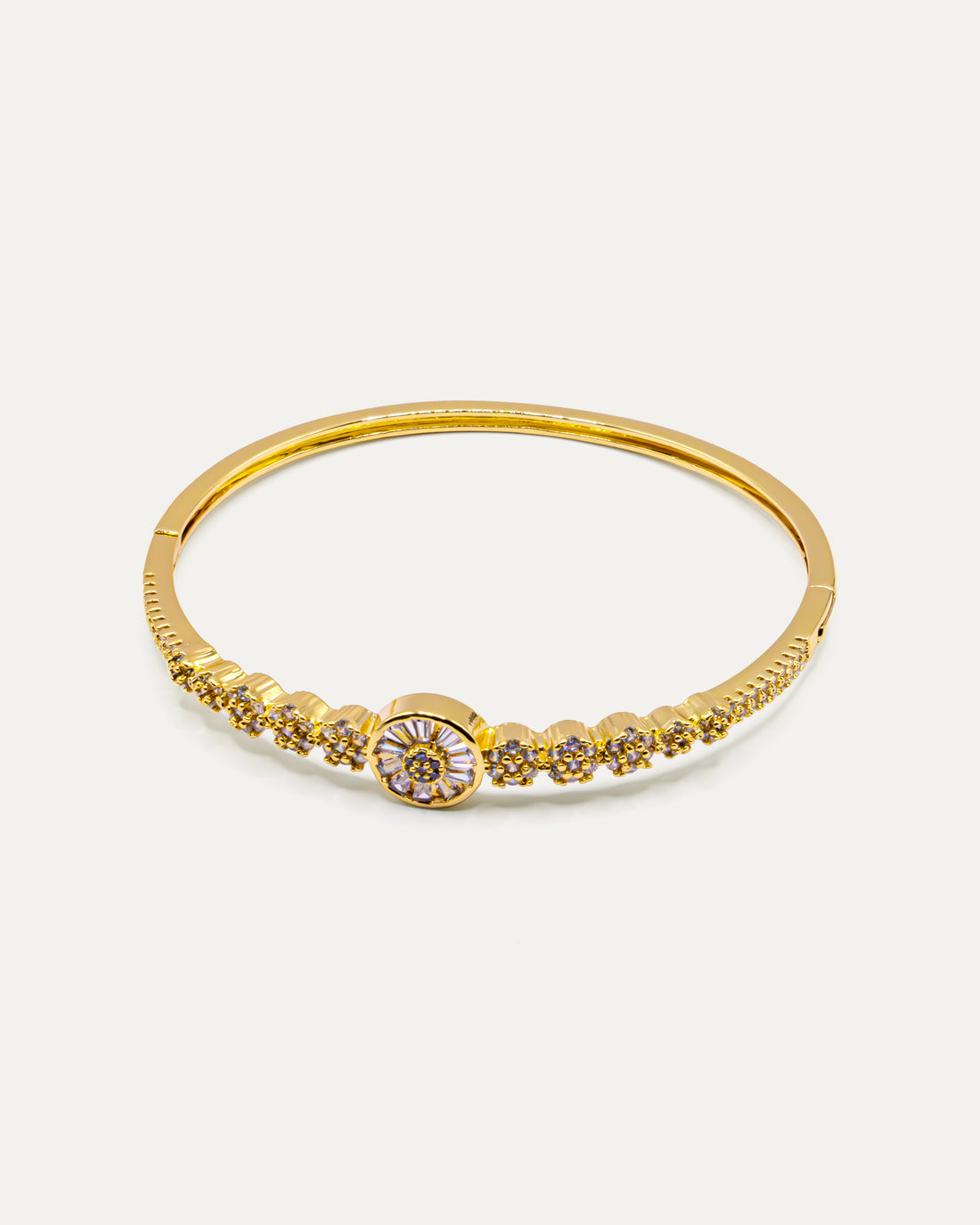 Gold bangle bracelet with floral centerpiece and sparkling crystals – Golden Bloom Radiance Bangle.