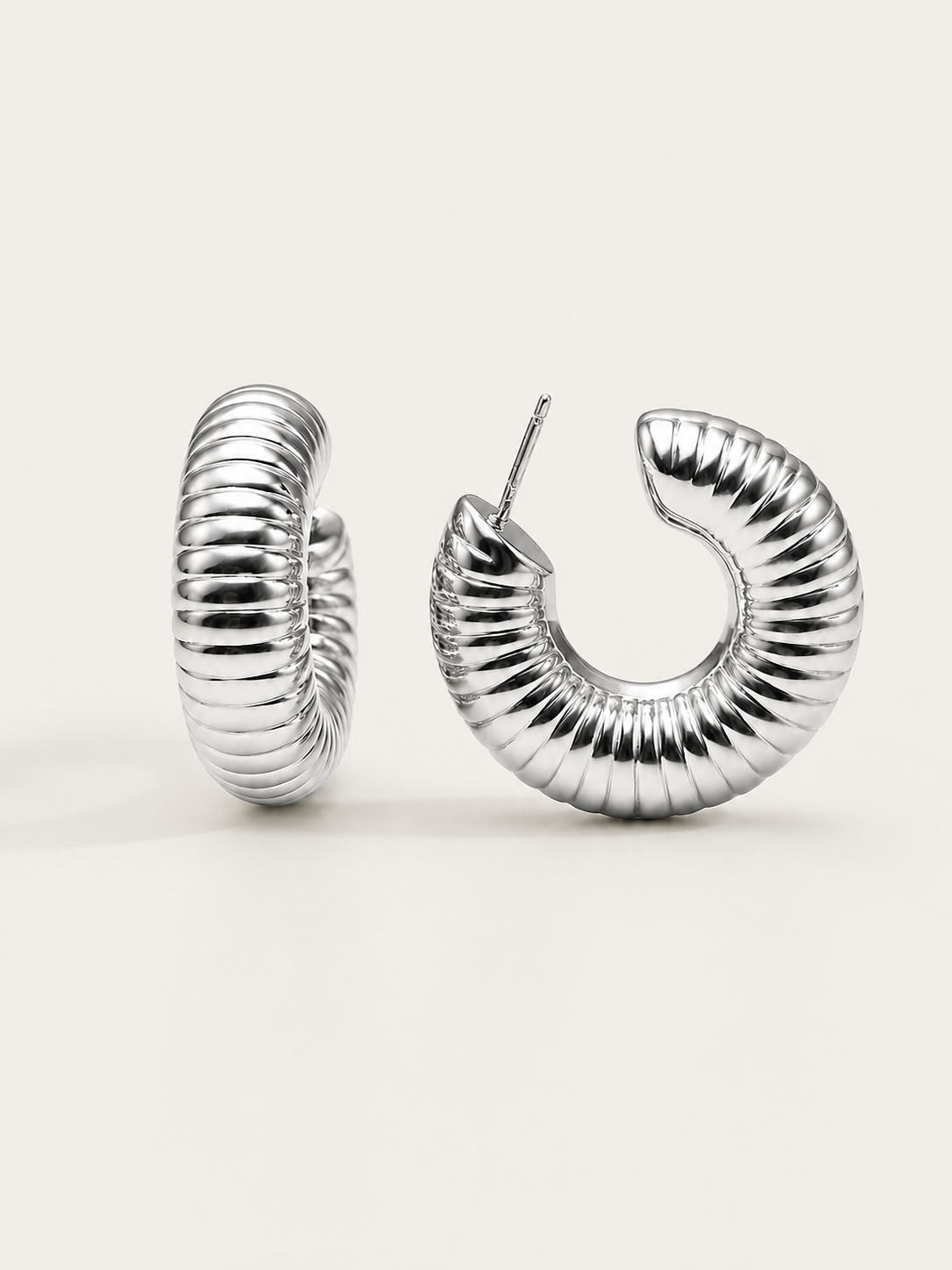 Silver grooved dome hoop earrings with ribbed texture and polished silver-plated finish